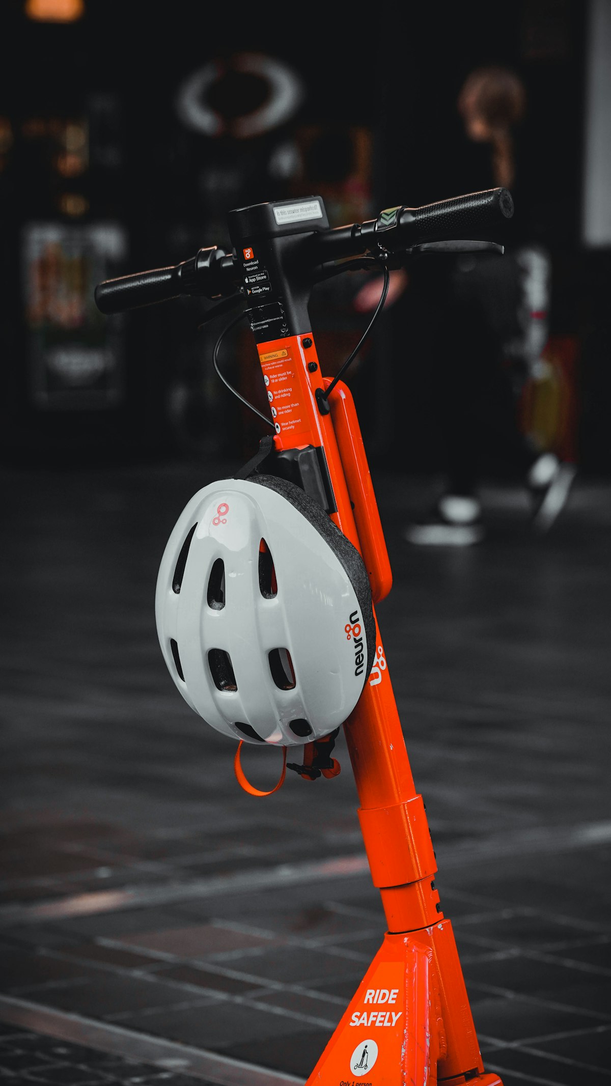 Generic electric scooter with a helmet resting on the handlebar